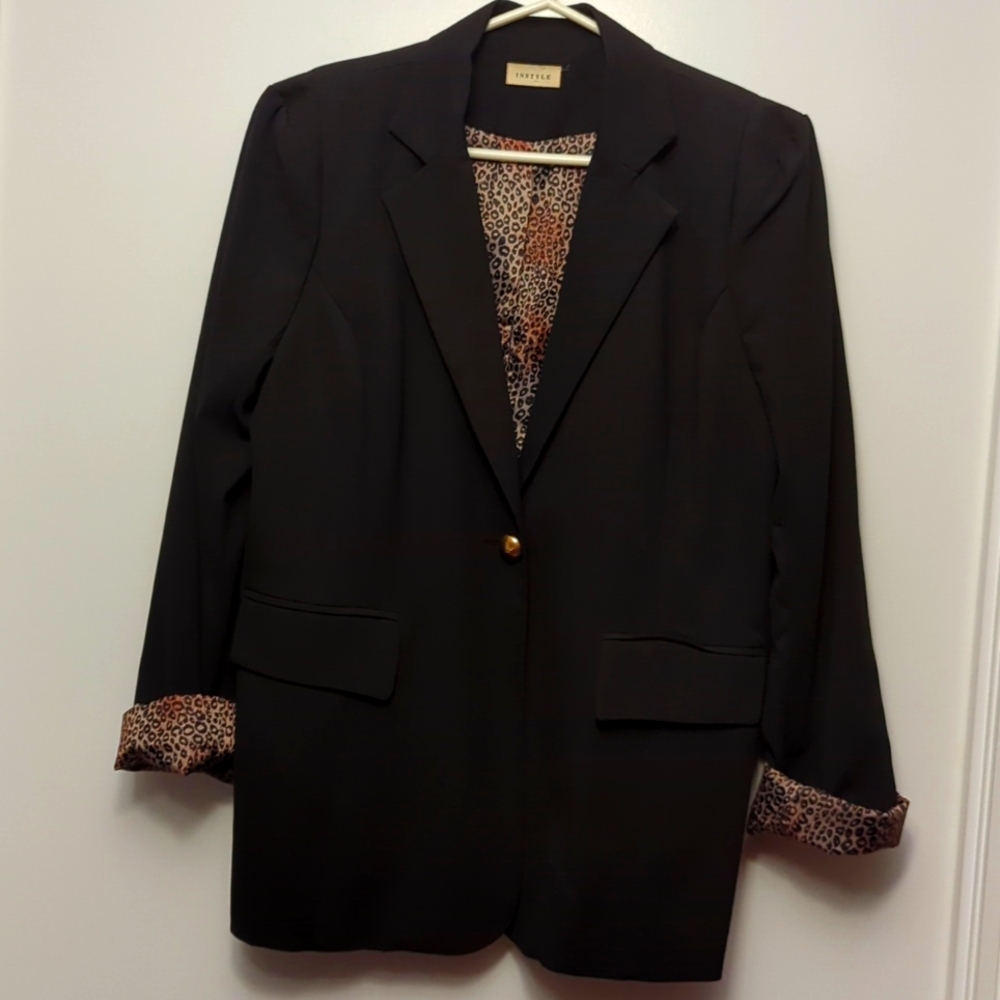 Light Jacket with Panther lining and gold button.